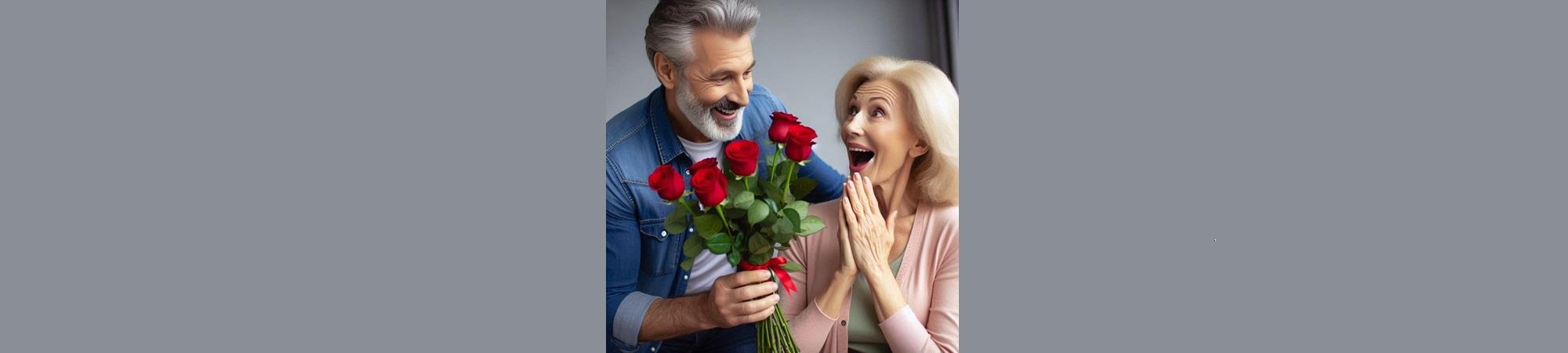 Husband presenting delighted wife with red roses